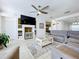 Comfortable living room with tile flooring and custom built-in shelving at 13319 Via Roma Cir, Clermont, FL 34711