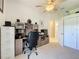 Functional home office setup with ample desk space and storage cabinets, great for remote work at 13319 Via Roma Cir, Clermont, FL 34711