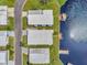 Aerial view of waterfront homes with private docks and lush landscaping on the canal at 1401 W Highway 50 # 142, Clermont, FL 34711