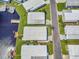 Aerial view of waterfront homes featuring docks and a lakeside community at 1401 W Highway 50 # 142, Clermont, FL 34711