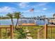 Beautiful backyard featuring a waterfront view, a dock, and stepping stones leading to the water at 1401 W Highway 50 # 142, Clermont, FL 34711