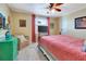 Cozy bedroom with ceiling fan, plush carpet, comfortable bedding, and lots of natural light at 1401 W Highway 50 # 142, Clermont, FL 34711