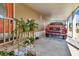 Carport featuring decorative plants and a parked vehicle at 1401 W Highway 50 # 142, Clermont, FL 34711