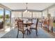 Charming dining area with water views, decorative chandelier, and lots of natural light at 1401 W Highway 50 # 142, Clermont, FL 34711