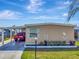 Charming single-story home with a covered parking area and well-maintained landscaping at 1401 W Highway 50 # 142, Clermont, FL 34711