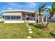 Charming single-story home with a well-maintained lawn and a inviting front porch area at 1401 W Highway 50 # 142, Clermont, FL 34711