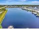 Picturesque lake view featuring waterfront homes and lush greenery at 1401 W Highway 50 # 142, Clermont, FL 34711
