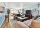 Comfortable living room with stylish furnishings and a view into the dining room and kitchen at 1401 W Highway 50 # 142, Clermont, FL 34711