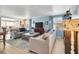 Inviting living room with plush seating, wood laminate flooring, and plenty of natural light through window at 1401 W Highway 50 # 142, Clermont, FL 34711