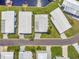 Aerial view of homes and streets in a meticulously maintained neighborhood at 1401 W Highway 50 # 143, Clermont, FL 34711