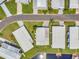 Aerial view of mobile home community with well-manicured lawns and waterfront access at 1401 W Highway 50 # 143, Clermont, FL 34711