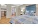 Bedroom with wood floors has a convenient ensuite bathroom and walk in closet at 1401 W Highway 50 # 143, Clermont, FL 34711