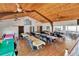 Spacious community room with tables, chairs, and a wood-paneled ceiling for gatherings at 1401 W Highway 50 # 143, Clermont, FL 34711