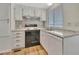 Clean kitchen with white cabinets, modern countertops, and appliances at 1401 W Highway 50 # 143, Clermont, FL 34711