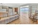Open concept living room with access to the sunroom and hard wood floors at 1401 W Highway 50 # 143, Clermont, FL 34711