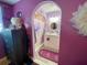 Bathroom featuring tiled walk-in shower, vanity and arched doorway, decorated with purple accents at 14657 Sw 41St Ave, Ocala, FL 34473