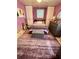 Bedroom with purple walls, a full bed, carpet, and built in storage on each side of the bed at 14657 Sw 41St Ave, Ocala, FL 34473