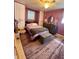 Bedroom with purple walls, a full bed, carpet, and built in storage on each side of the bed at 14657 Sw 41St Ave, Ocala, FL 34473