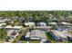 Aerial view of a neighborhood with well-maintained homes and lush greenery at 150 Hickory Ln, Eustis, FL 32726