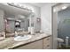 Well-lit bathroom with a granite countertop, vanity, mirror, and a toilet at 150 Hickory Ln, Eustis, FL 32726