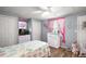 Bright bedroom with pink accents, and coastal decorations at 150 Hickory Ln, Eustis, FL 32726