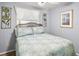 Comfortable bedroom with blue and white coastal bedding and a large window at 150 Hickory Ln, Eustis, FL 32726
