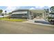 Single-story home with a covered entrance and manicured lawn at 150 Hickory Ln, Eustis, FL 32726