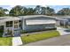 Well maintained single-story home with a manicured lawn and front porch at 150 Hickory Ln, Eustis, FL 32726