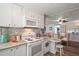 Kitchen features an open layout with a counter seating and dining area at 150 Hickory Ln, Eustis, FL 32726