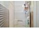 Walk in shower featuring a built in seat and safety grab bar at 150 Hickory Ln, Eustis, FL 32726