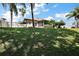 Expansive backyard featuring a hammock and screened-in porch, perfect for relaxation at 1554 Sarus Ave, Groveland, FL 34736