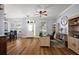 Versatile living space combining a dining area with a cozy office setup, featuring hardwood floors at 1554 Sarus Ave, Groveland, FL 34736