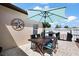 Outdoor patio with table and grill, perfect for outdoor dining and entertaining near a grill at 1554 Sarus Ave, Groveland, FL 34736