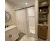 Bright bathroom featuring tiled shower-tub and decorative shelving at 1650 Sundance Dr, St Cloud, FL 34771