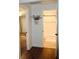 Hallway view to bathroom and bedroom, showing tile and carpet floors, respectively at 1650 Sundance Dr, St Cloud, FL 34771