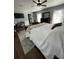 Spacious bedroom featuring a ceiling fan, and view to ensuite bathroom at 1650 Sundance Dr, St Cloud, FL 34771
