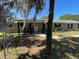 Charming single-story home featuring stone accents, a welcoming porch, and mature landscaping at 1650 Sundance Dr, St Cloud, FL 34771