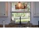 Bright kitchen view with garden window over sink and granite countertops at 1650 Sundance Dr, St Cloud, FL 34771