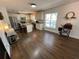 Bright kitchen area with stainless steel appliances, granite countertops, and ample cabinet space, open to the dining area at 1650 Sundance Dr, St Cloud, FL 34771