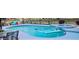 Beautiful pool and spa with in-pool lounge floats, and an outdoor seating area, perfect for summer fun at 1650 Sundance Dr, St Cloud, FL 34771