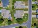 Aerial view showcases the neatly kept property, including the lawn and patterned driveway at 17374 Se 76Th Flintlock Ter, The Villages, FL 32162