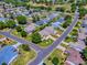 Wonderful aerial view in a serene community near a golf course, with neatly trimmed lawns and cozy homes at 17374 Se 76Th Flintlock Ter, The Villages, FL 32162
