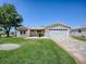 Inviting home exterior features a manicured lawn, stone accents, and a patterned driveway at 17374 Se 76Th Flintlock Ter, The Villages, FL 32162