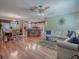 Open-concept layout with living room, dining area, and kitchen, perfect for entertaining at 17374 Se 76Th Flintlock Ter, The Villages, FL 32162