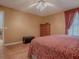 A cozy main bedroom with a tall dresser and ample closet space for organized storage at 17374 Se 76Th Flintlock Ter, The Villages, FL 32162