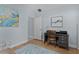 Comfortable bedroom with blue walls, wooden desk, and decor at 1754 Pennecamp Dr, The Villages, FL 32162