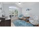 Light-filled bedroom with vaulted ceiling, shuttered windows, hardwood floors, and serene decor at 1754 Pennecamp Dr, The Villages, FL 32162