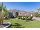 Beautiful home featuring well-kept landscaping, a two-car garage, and a welcoming entrance perfect for suburban living at 1754 Pennecamp Dr, The Villages, FL 32162