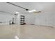 Spacious and clean garage with epoxy floors, ample storage, and bright lighting ready for your vehicles and hobbies at 1754 Pennecamp Dr, The Villages, FL 32162