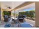Covered lanai with ceiling fan, providing a perfect space for outdoor relaxation at 1754 Pennecamp Dr, The Villages, FL 32162